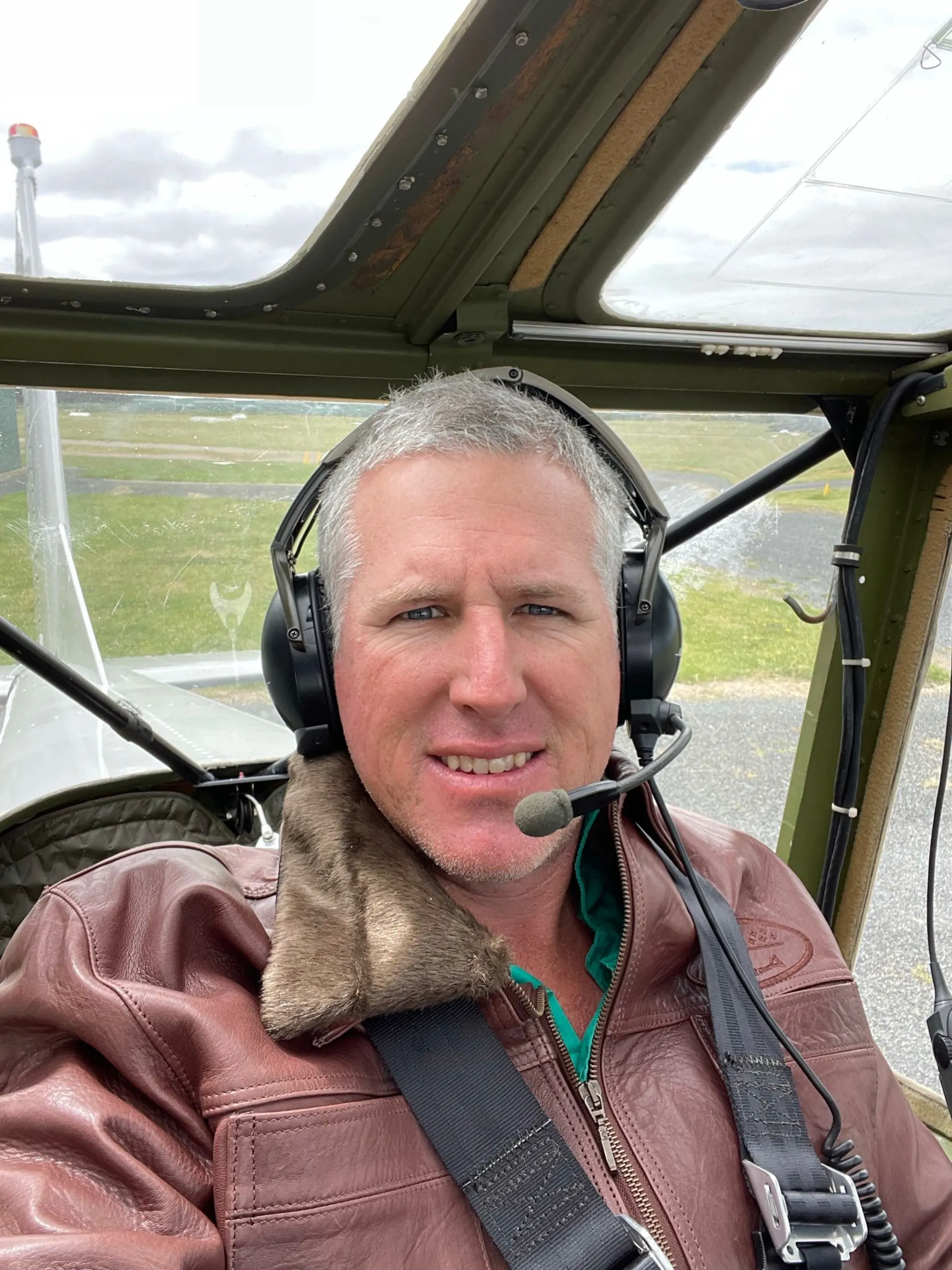 Tim in the cockpit of a vintage plane