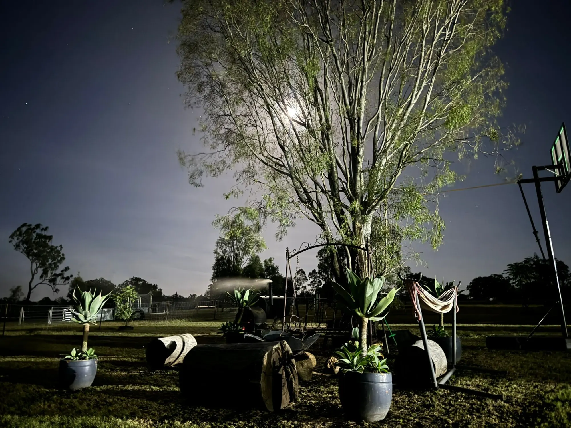 The mobile-office rig parked under a tree at night