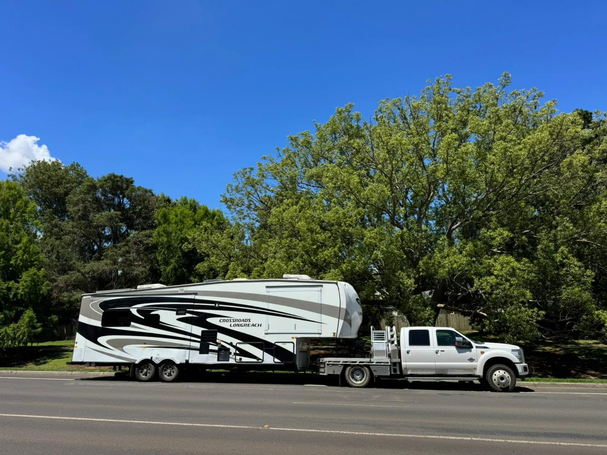 The Lone Star truck and 5th-wheeler rig parked roadside