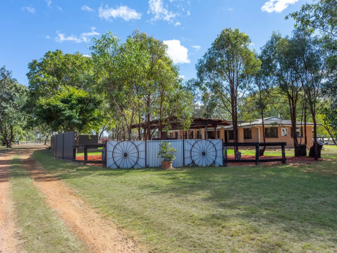 Gravel driveway leading through the trees to the homestead at 79 Brigalow Street, Placid Hills