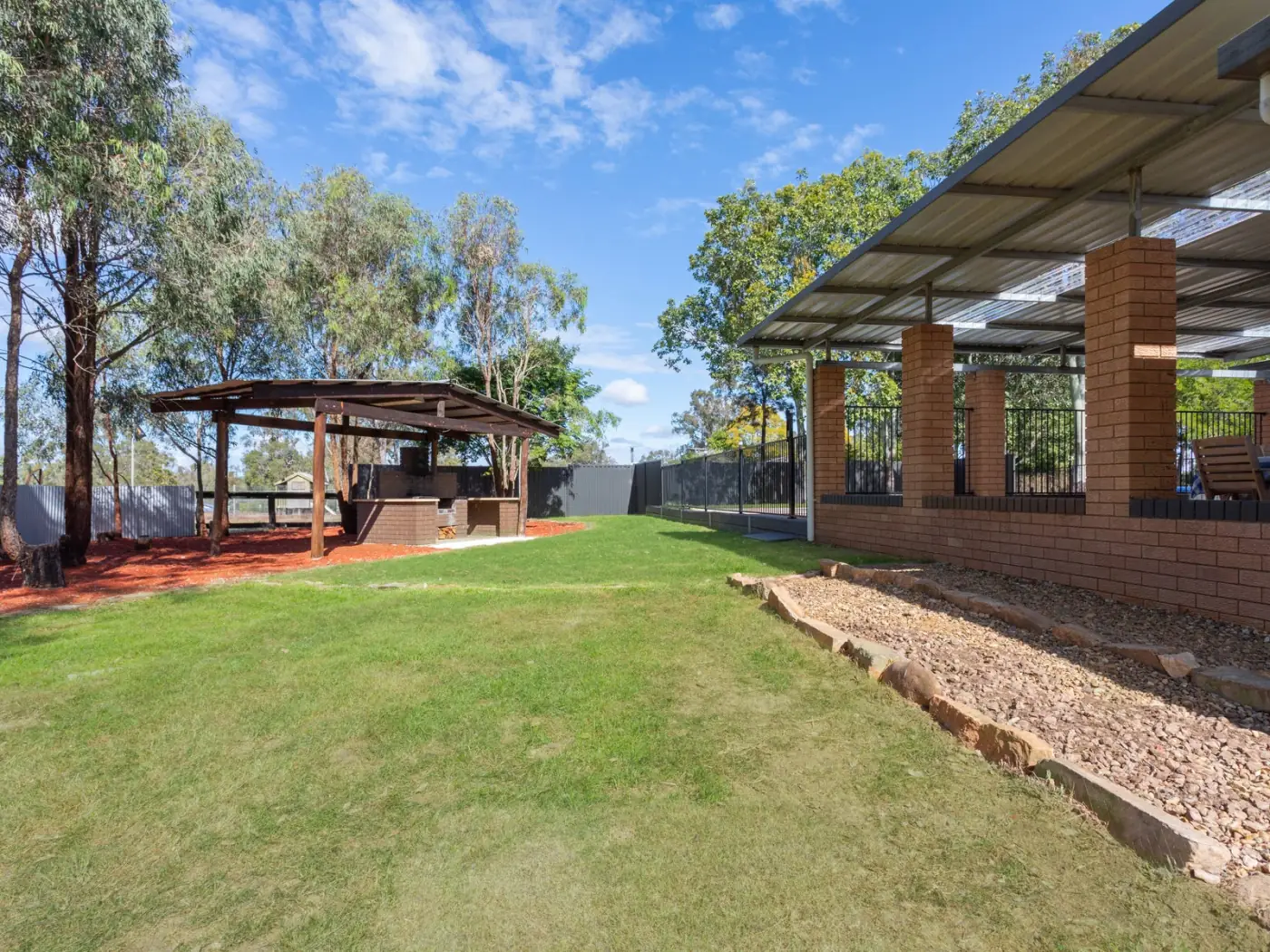 Timber gazebo and barbecue area on the lawn