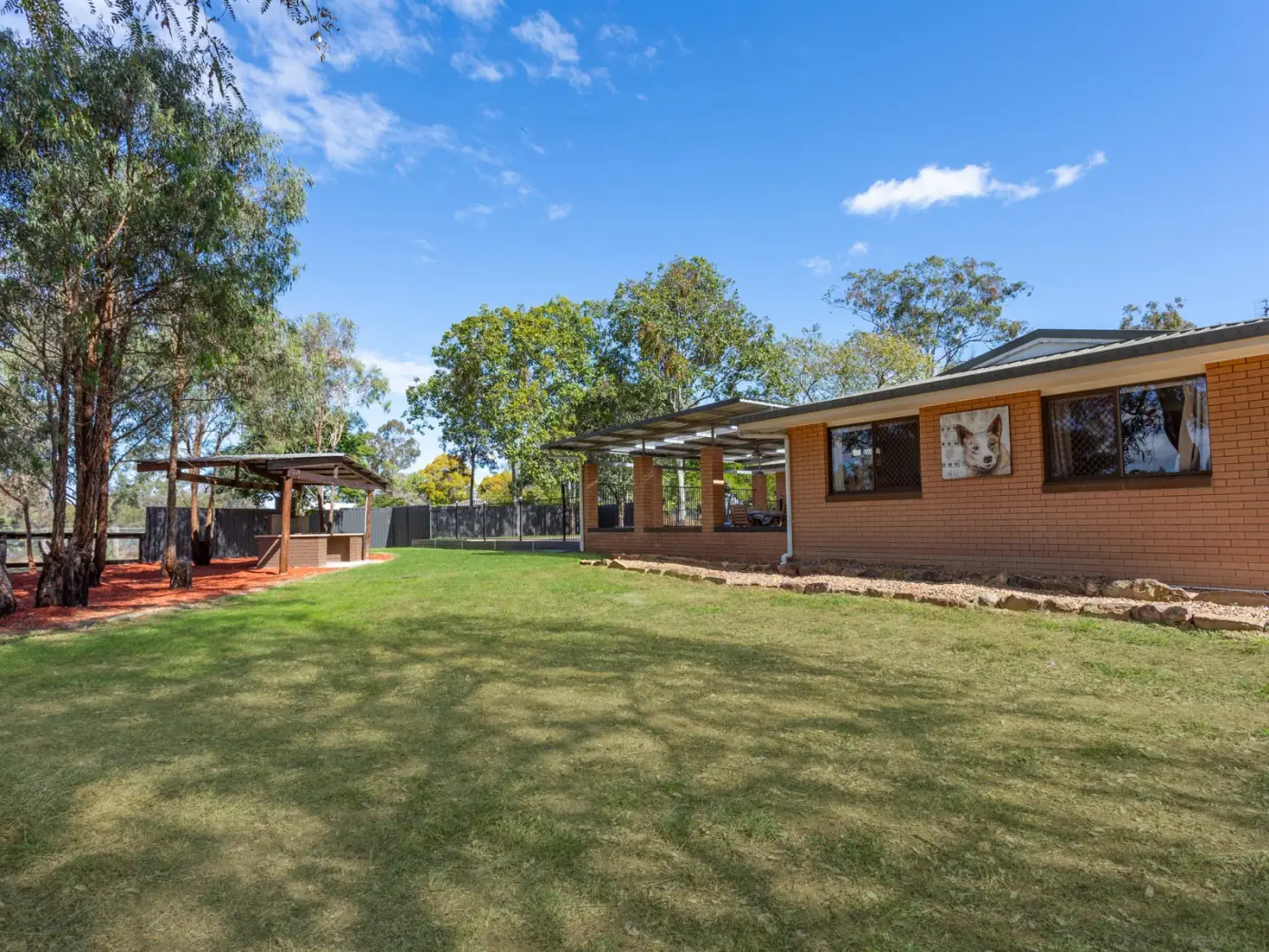 Homestead and lawn with the covered gazebo and entertaining area